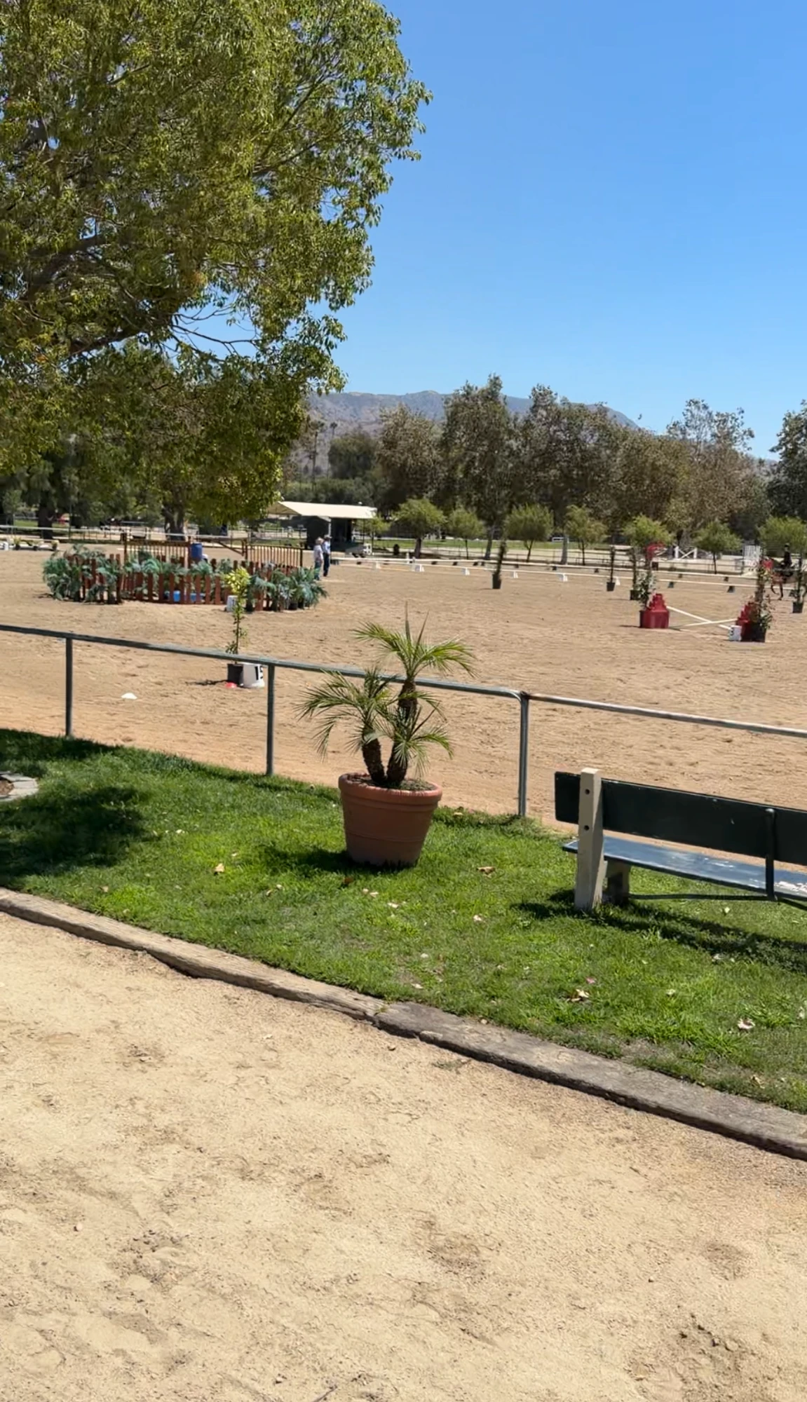The Working Equitation arena at Hansen Dam Horse Park set with obstacles, with the San Gabriel foothills behind